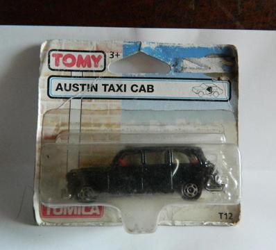 Antiguo autito Tomy taxi Austin Taxi Cab, en blister